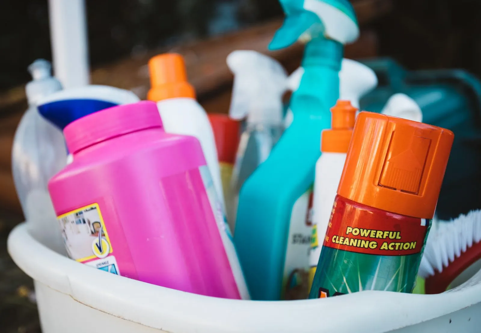 Photo of cleaning supplies organized in a caddy for under-sink storage